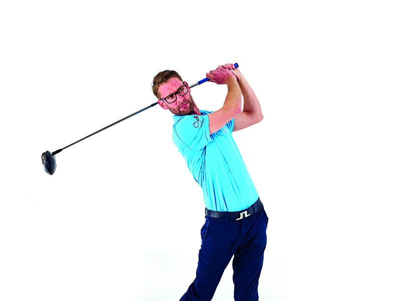 Top 50 Coach Tom Motley in the finish position of the golf swing with driver