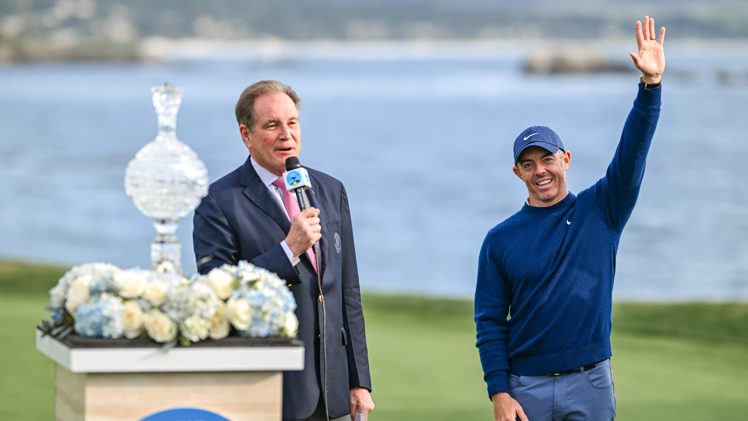 Rory McIlroy is presented with the AT&amp;T Pebble Beach Pro-Am trophy