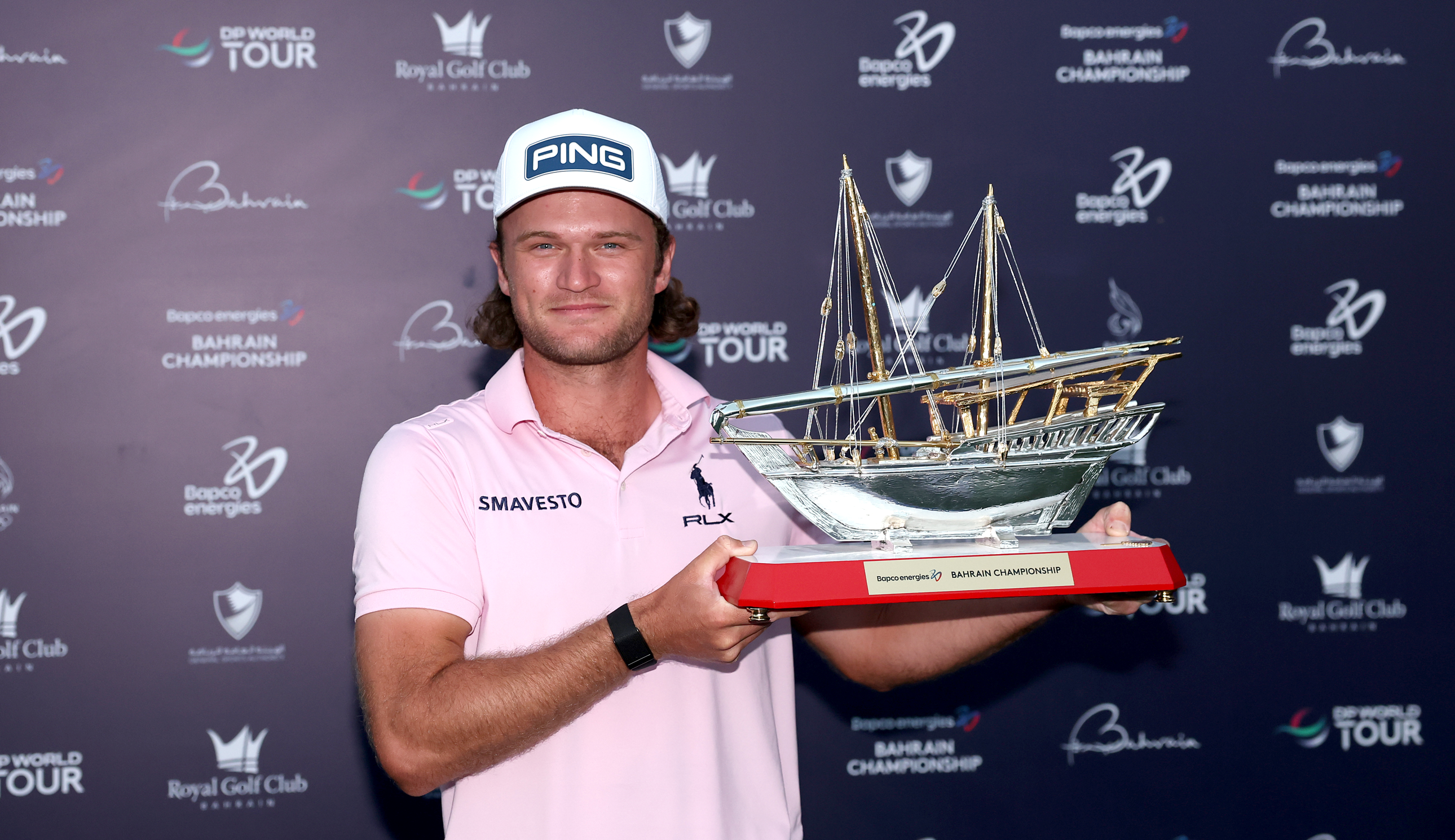 Freddy Schott holds the Bahrain Championship trophy
