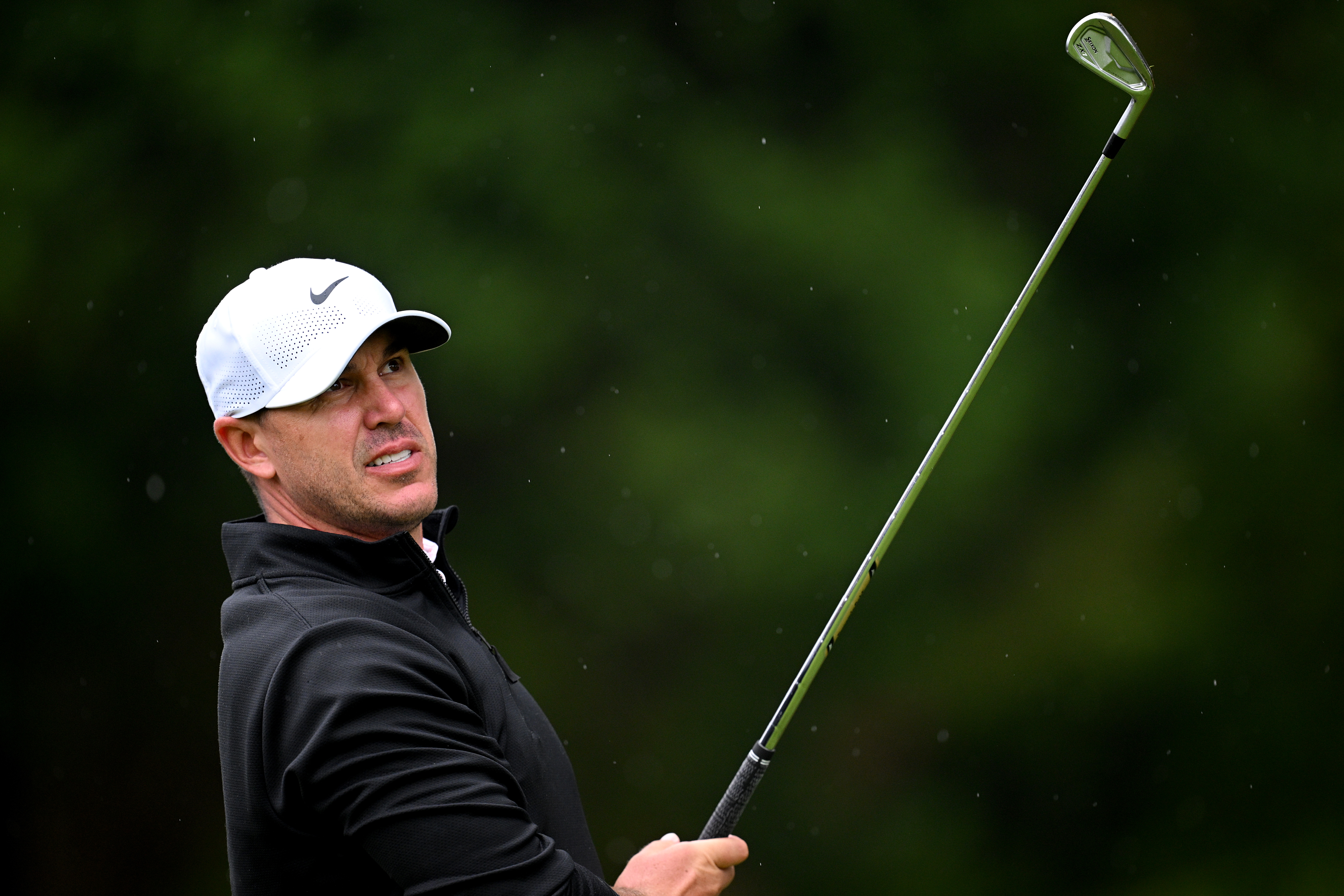 Brooks Koepka hits an iron shot