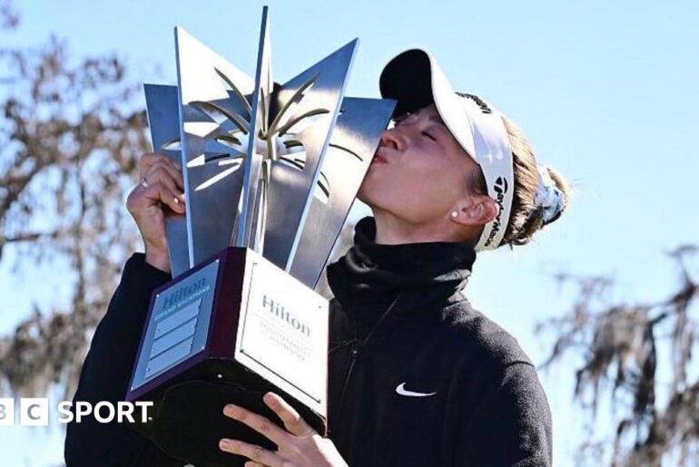 Nelly Korda kisses the winners trophy