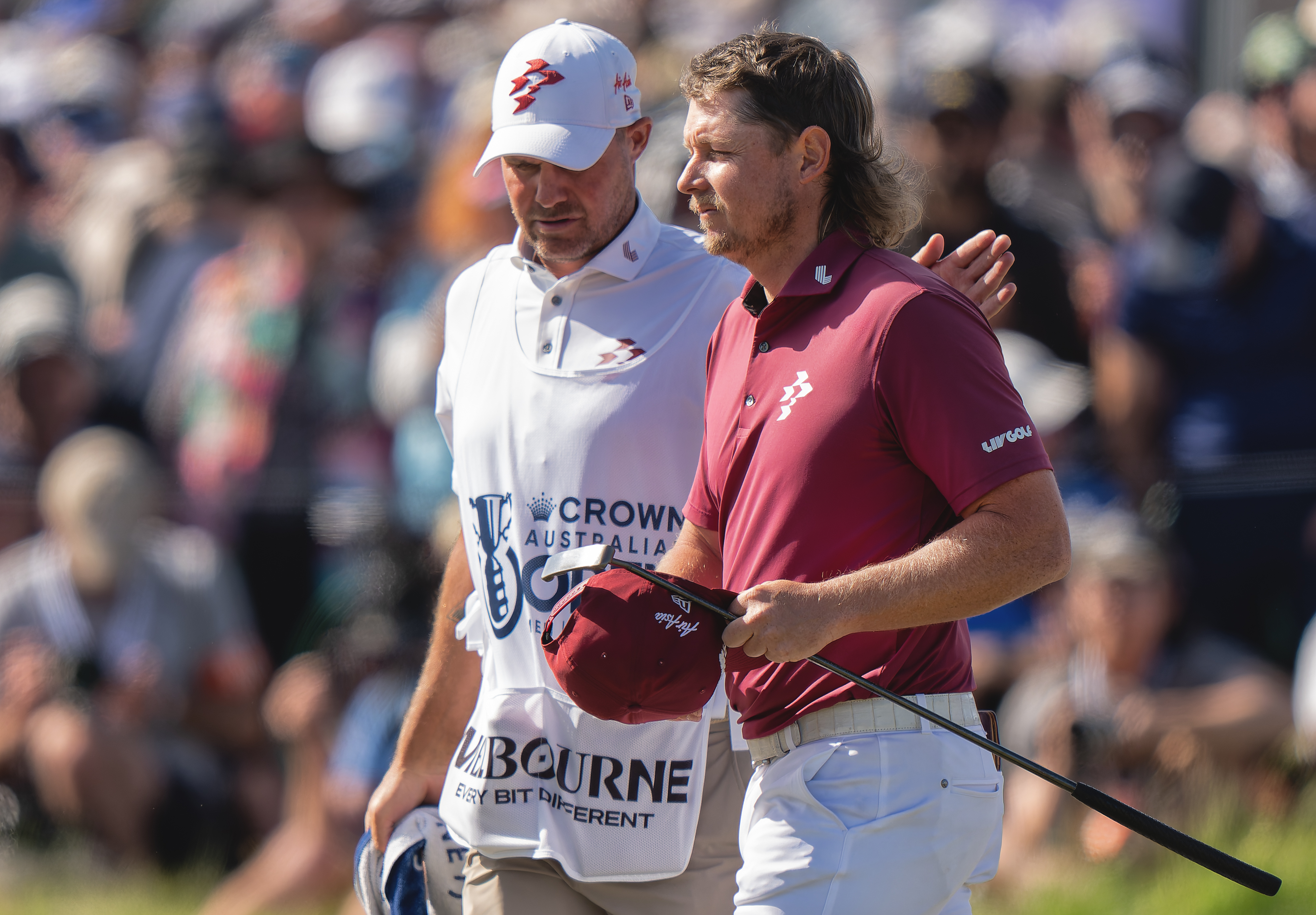 Cameron Smith and his caddie walk off the green