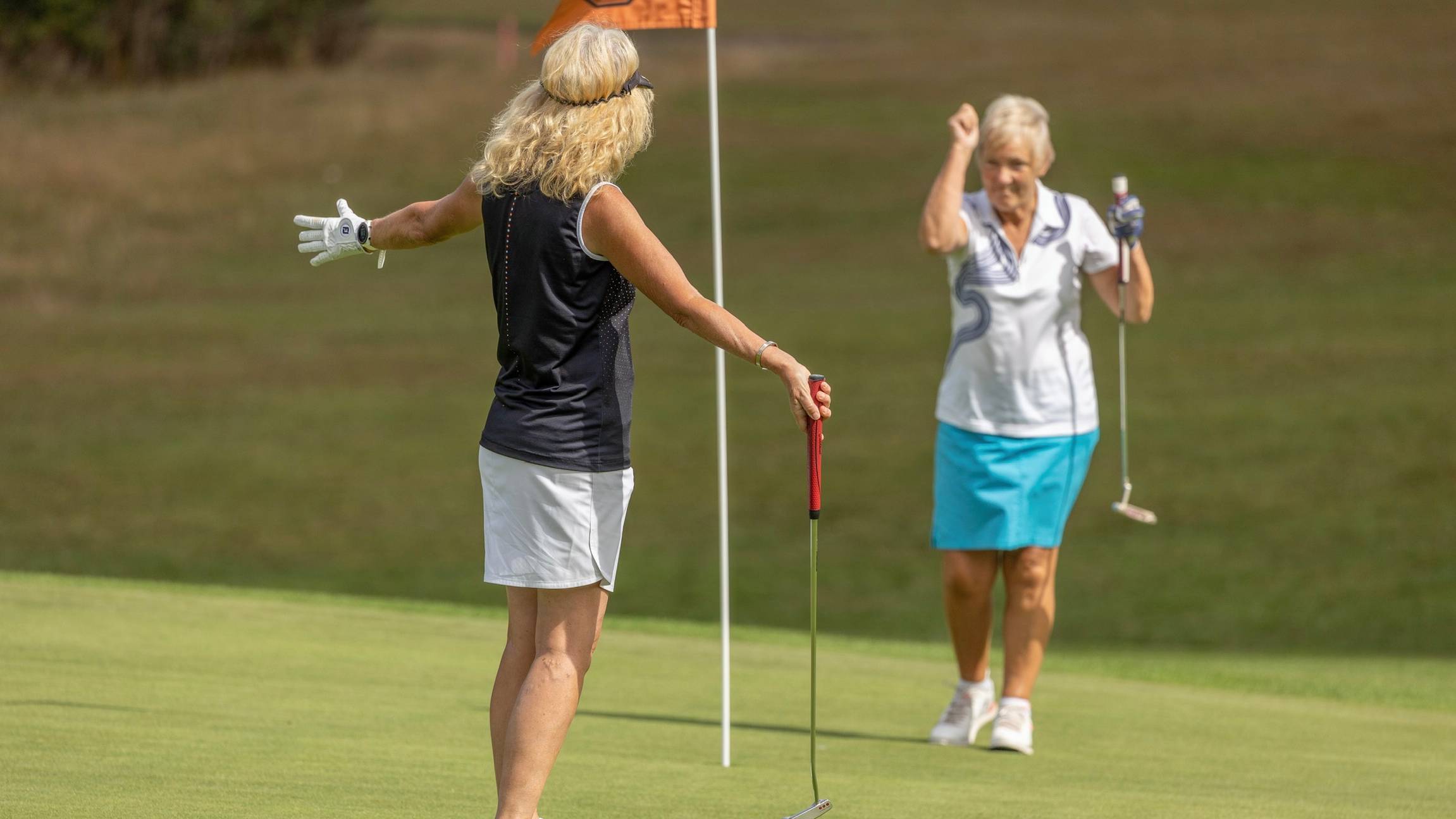 Women celebrating on the green
