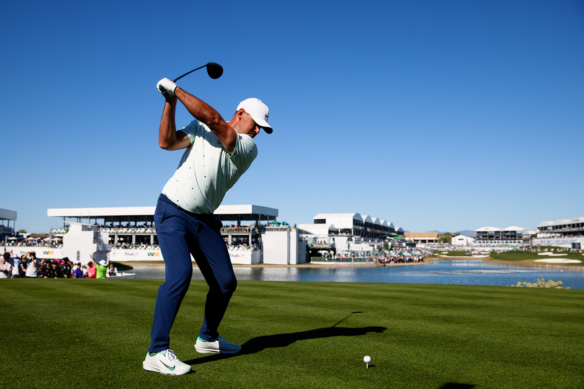 Brooks Koepka hitting a driver in a practice round at the WM Phoenix Open on the PGA Tour after returning from LIV Golf in 2026