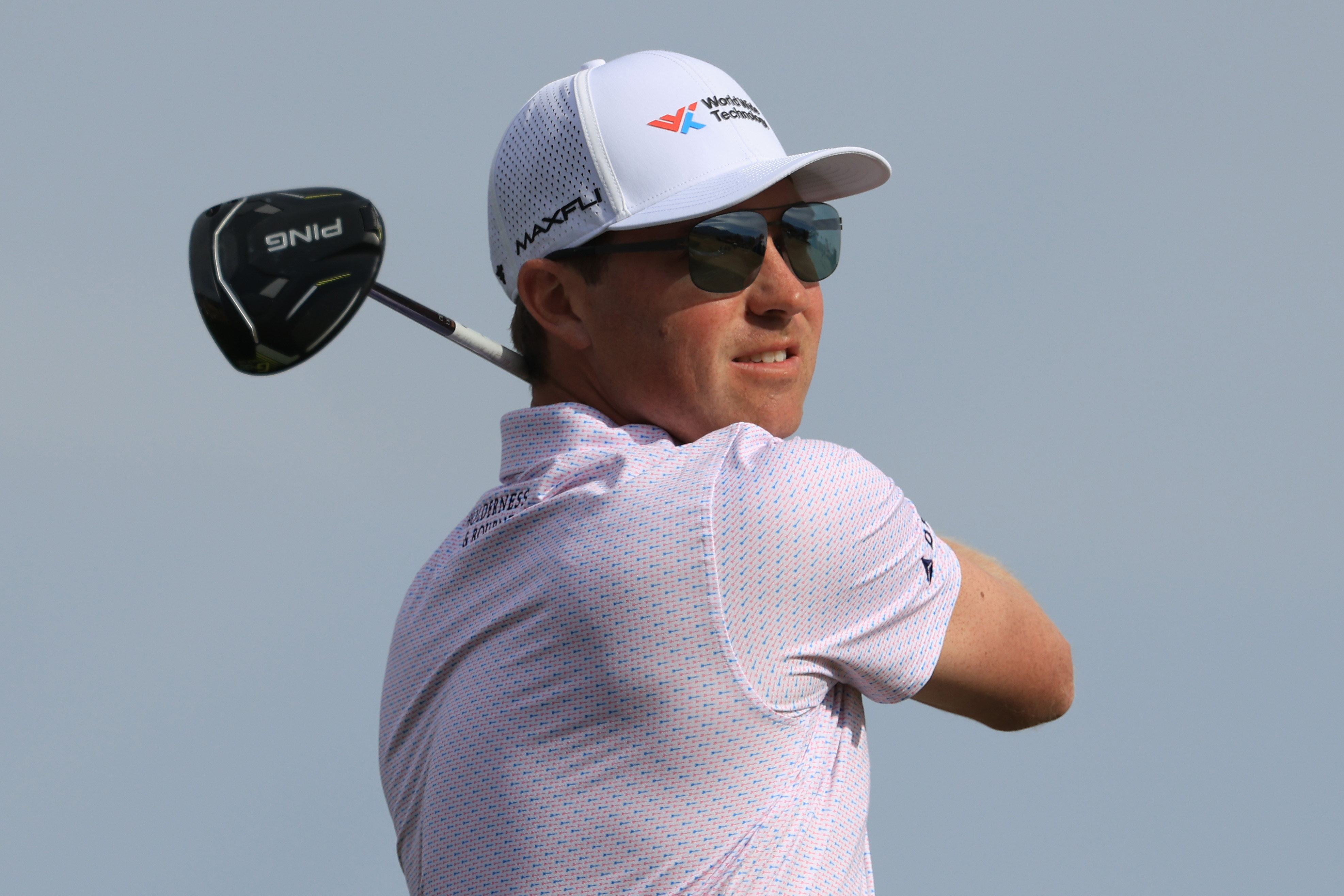 Ben Griffin watches his drive off the tee