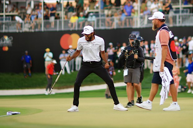 Akshay Bhatia celebrates after winning the tournament on the 18th green.
