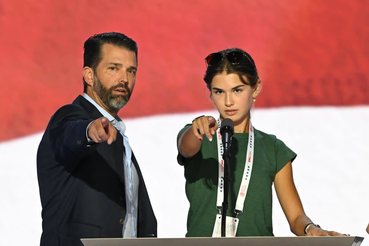Trump and her father, Donald Trump Jr., during a podium check ahead of her appearance at the Republican National Convention in Wisconsin in 2024 (AFP via Getty Images)