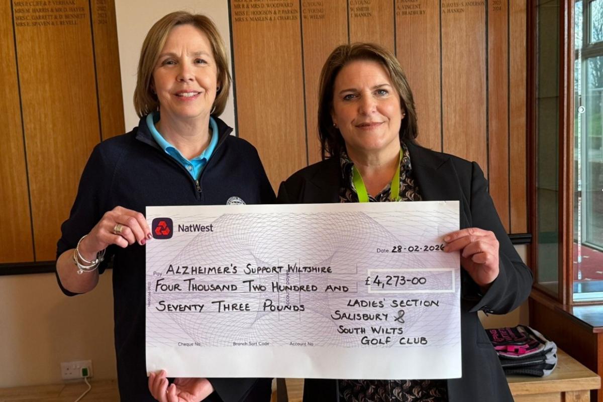 Golf club captain presents more than £4,000 raised for dementia charity