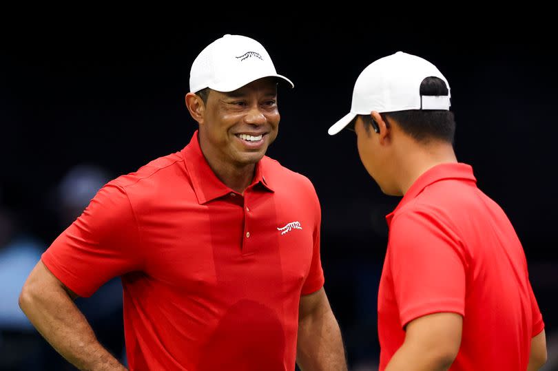 Tiger Woods and Tom Kim