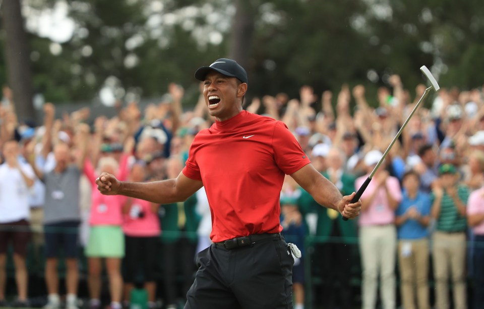 Tiger Woods of the United States celebrates on the 18th green after winning the Masters at Augusta National Golf Club on April 14, 2019