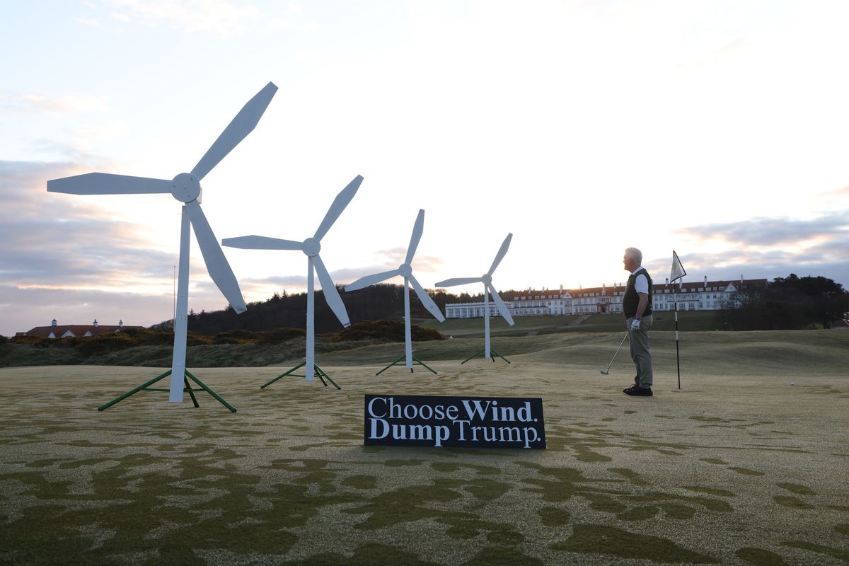 Greenpeace activists install a wind farm on a green of the Trump Turnberry Golf Club