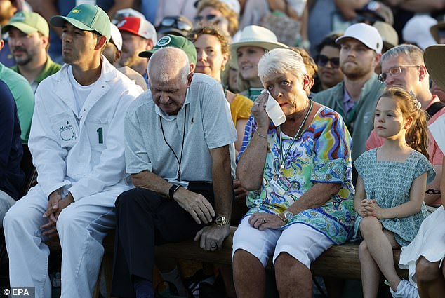 McIlroy's mother Rosie wipes away the tears after seeing him triumph at Augusta on Sunday