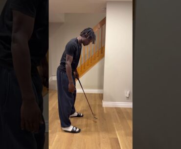 How far should you stand from the golf ball?