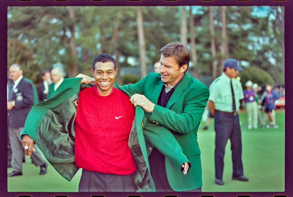 04/13/1997; Augusta, Georgia, USA; Nick Faldo presents Tiger Woods with the green jacket at the Augusta National Golf Course during the 1997 Masters. Mandatory Credit: File Photo -The Augusta Chronicle via USA TODAY NETWORK© The Augusta Chronicle-USA TODAY NETWORK&period;