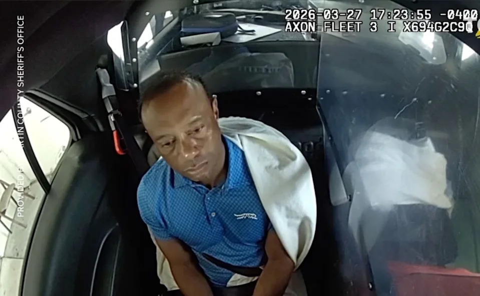 The five-time Masters champ (pictured here in a police cruiser after being detained) was arrested and charged with misdemeanor DUI with property damage in Jupiter Island on March 27. Martin County Sheriff's Office