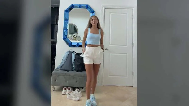 Kai Trump modeled a blue-and-white outfit while lip-syncing to an ABBA song. By: @thekaitrumpgolfer/TikTok