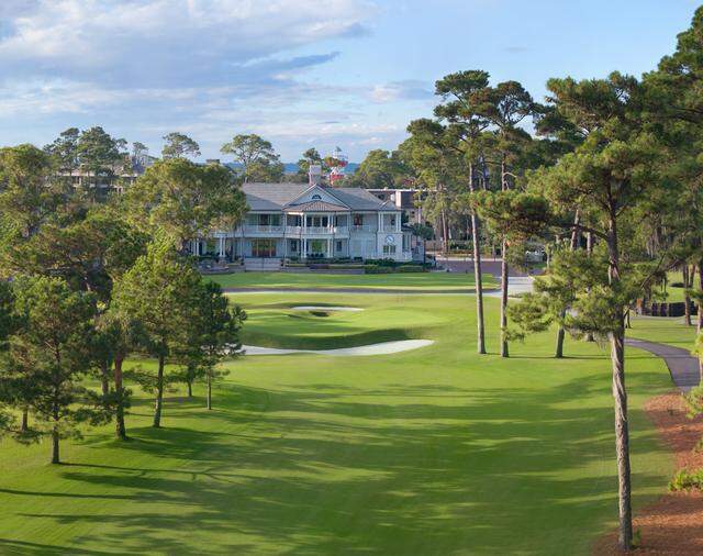 The fully restored 9th hole at Harbour Town Golf Links at Sea Pines Resort, showcasing the iconic Inn and Club at Harbour Town.