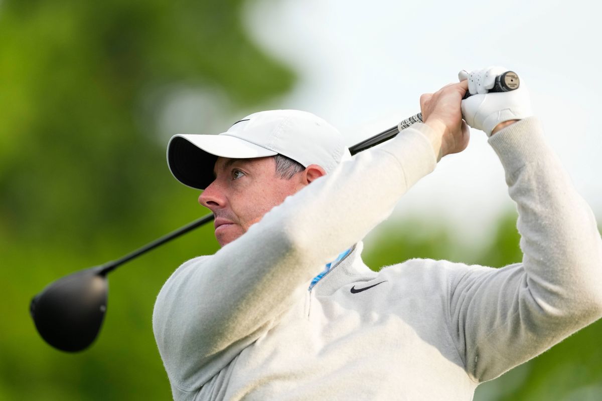 Rory McIlroy of Northern Ireland watches his tee shot during a pro-am presented by Reliaquest prior to the Truist Championship at Quail Hollow Club