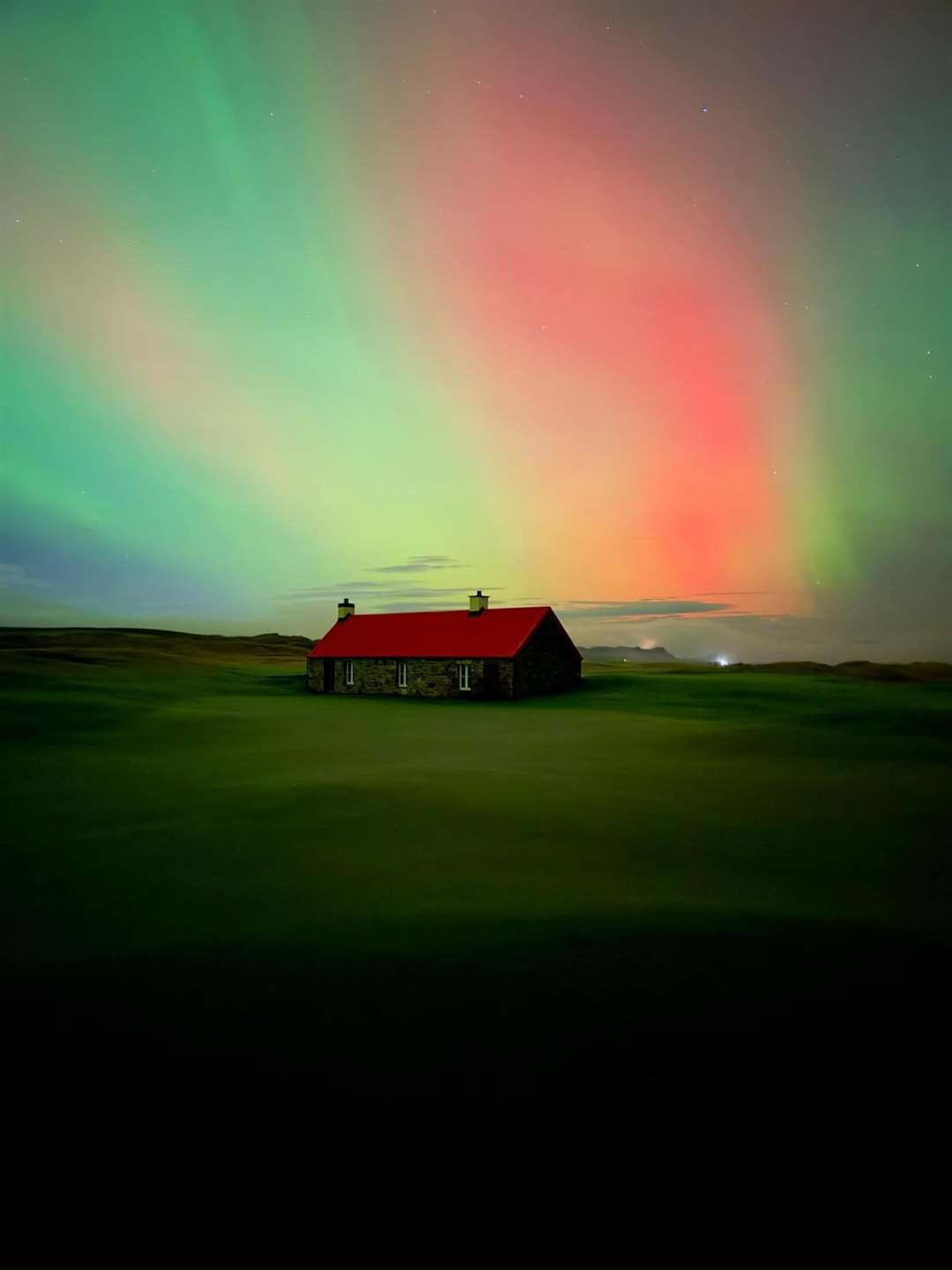 Northern lights visible above Cabot Highlands. Image courtesy of Kane Partners