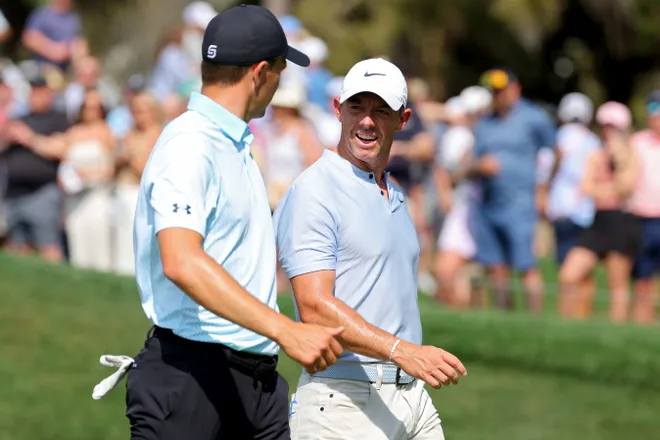 Jordan Spieth of the United States and Rory McIlroy of Northern Ireland walks off the seventh green during the second round of THE PLAYERS Championship on the Stadium Course at TPC Sawgrass on March 15, 2024 in Ponte Vedra Beach, Florida.
