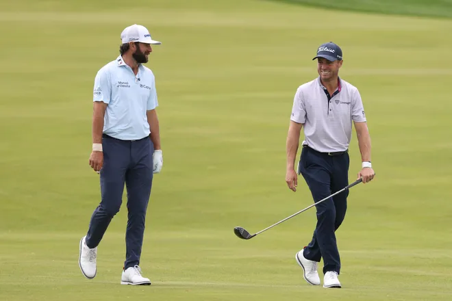 Cameron Young of the United States and Justin Thomas of the United States walk the ninth hole during a practice round prior to the PGA Championship at Aronimink Golf Club on May 13, 2026 in Newtown, Pennsylvania.
