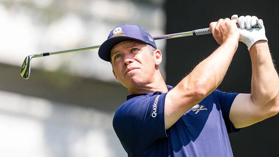  Paul Casey holds his finish on an iron shot. 