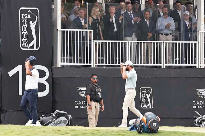 DORAL, FLORIDA - MAY 03: President Donald Trump reacts as Cameron Young of the United States walks off the on the 18th green during the final round of the Cadillac Championship 2026 at Trump National Doral Miami on May 03, 2026 in Doral, Florida. (Photo by Carmen Mandato/Getty Images)
