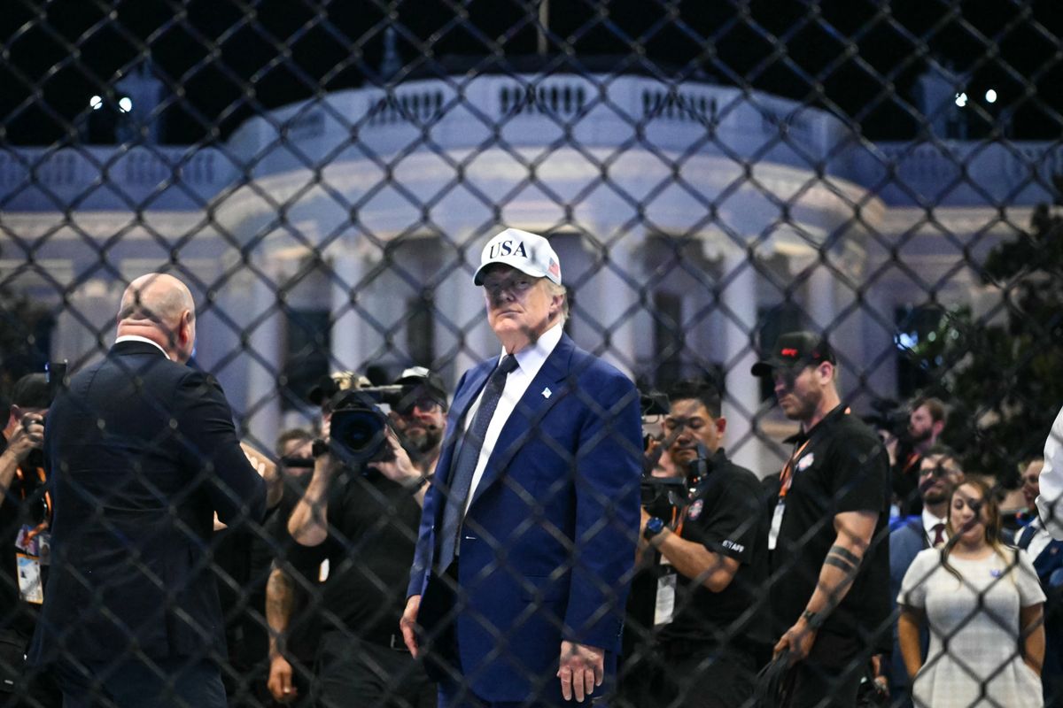 US President Donald Trump stands in The Octagon at the conclusion of the "UFC Freedom 250" mixed martial arts event on the South Lawn of the White House in Washington, DC, in the early morning hours of June 15, 2026