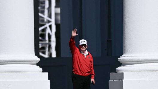 President Donald Trump waved as he returned to the White House in Washington, D.C., on Sunday, after golfing at his Trump National Golf Club in Sterling, Virginia.