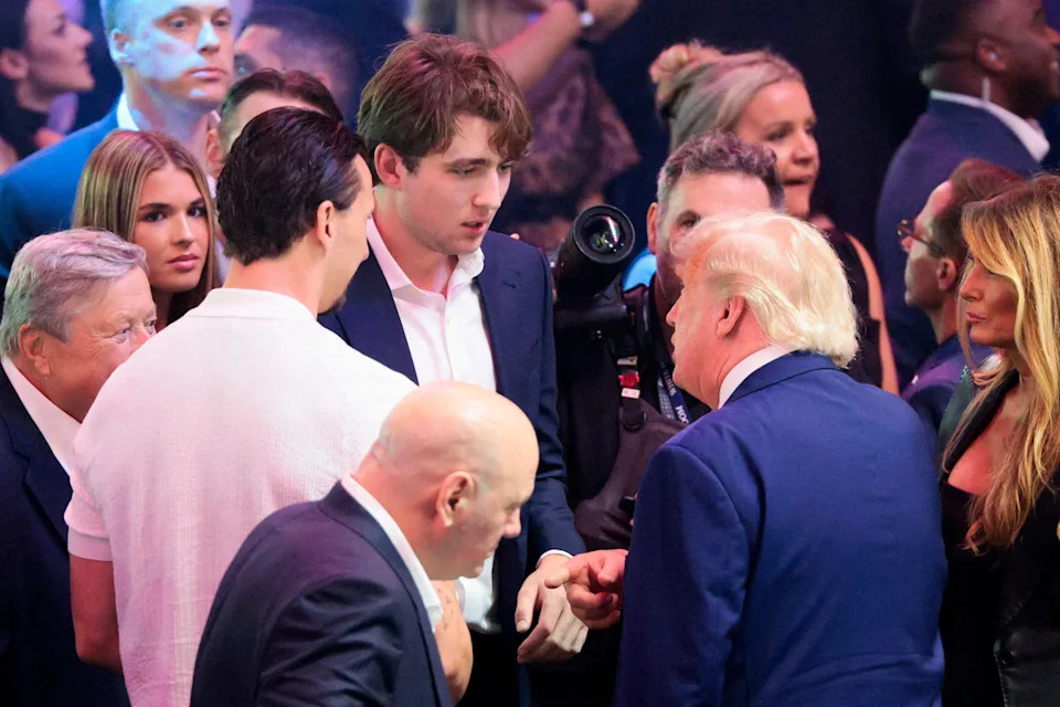 Trump talks to Barron and former soccer player Zlatan Ibrahimovic during UFC Freedom 250 on the South Lawn. / Evan Vucci / REUTERS