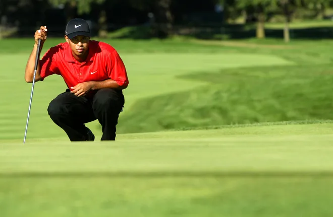 Tiger Woods lines up a putt on the 15th hole during the final round of the 2006 PGA Championship at Medinah Country Club.