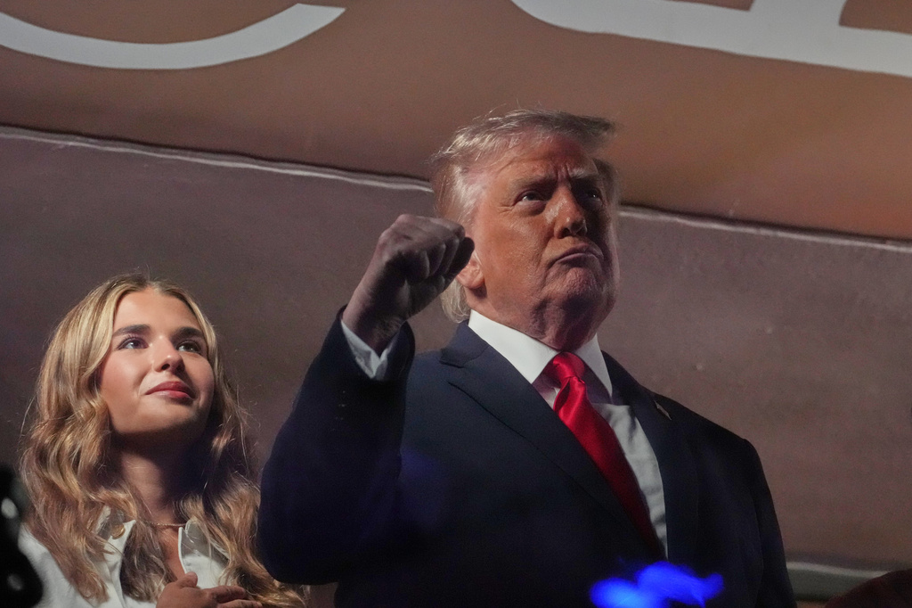 President Donald Trump gestures during the National Anthem as he attends an NBA Finals playoff basketball game between the New York Knicks and the San Antonio Spurs at Madison Square Garden in New York, Monday, June 8, 2026, with Kai Trump, left.
