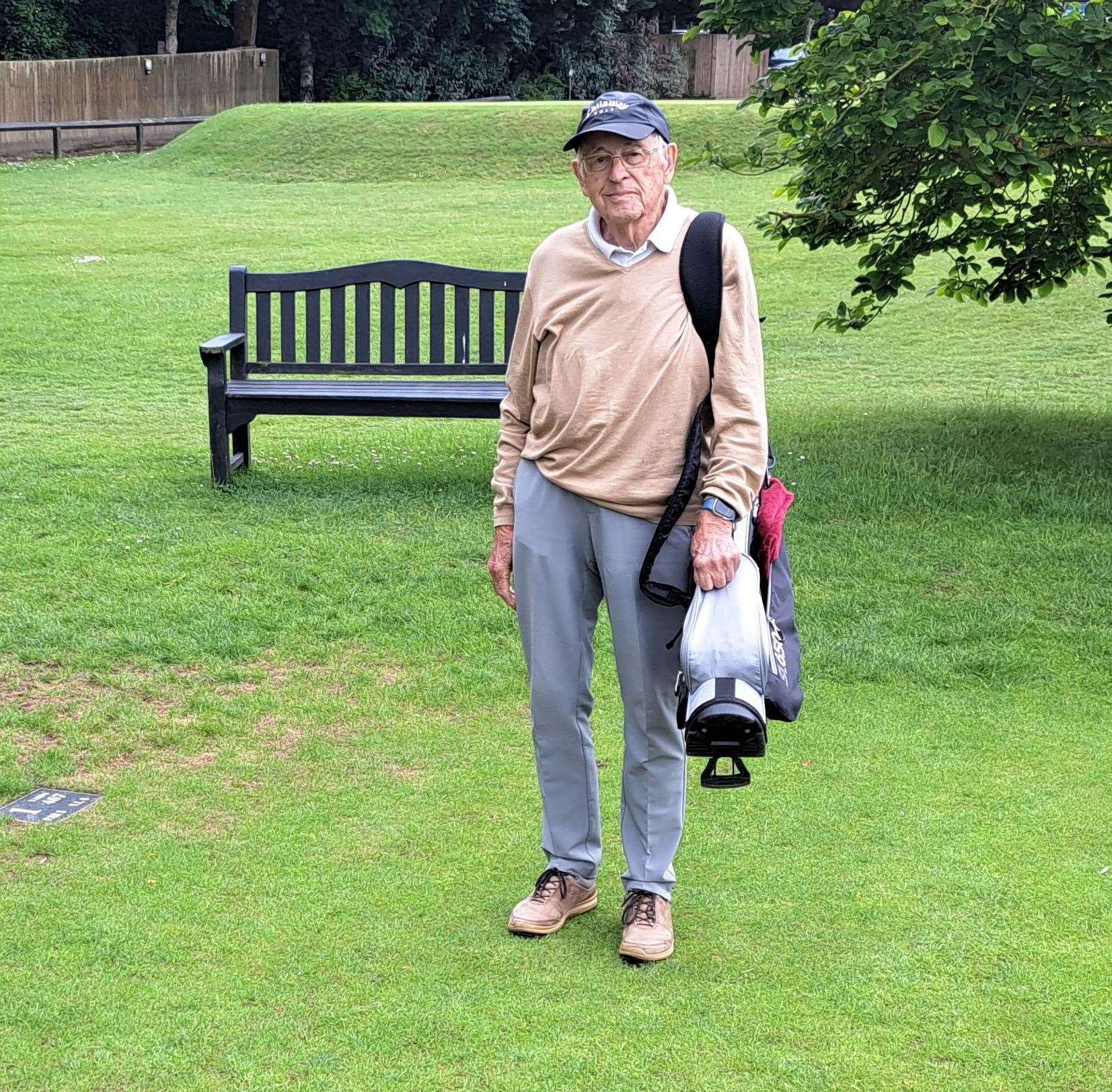 Christopher Martin, 100, with his bag of clubs at Canterbury Golf Club