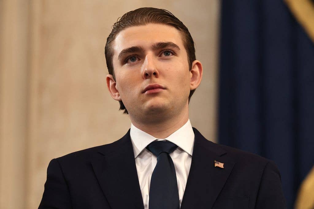 photo of barron trump in suit at inauguration of donald trump
