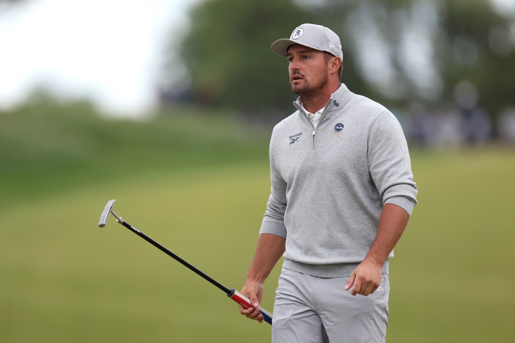 Bryson DeChambeau reacts while holding a putter on the seventh green during the second round of the PGA Championship.