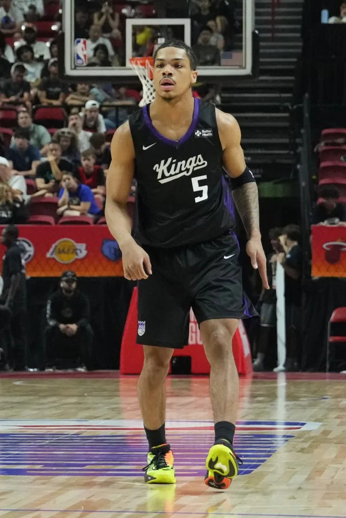Darius Acuff Jr. #5 of the <a class="link " href="https://sports.yahoo.com/nba/teams/sacramento/" data-i13n="sec:content-canvas;subsec:anchor_text;elm:context_link" data-ylk="slk:Sacramento Kings;sec:content-canvas;subsec:anchor_text;elm:context_link;itc:0" data-yga="{"yLinkElement":"context_link","yModuleName":"content-canvas","yLinkText":"Sacramento Kings","ySubModuleName":"anchor_text","yHasCommerce":false}">Sacramento Kings</a> looks on during the game against the <a class="link " href="https://sports.yahoo.com/nba/teams/la-clippers/" data-i13n="sec:content-canvas;subsec:anchor_text;elm:context_link" data-ylk="slk:LA Clippers;sec:content-canvas;subsec:anchor_text;elm:context_link;itc:0" data-yga="{"yLinkElement":"context_link","yModuleName":"content-canvas","yLinkText":"LA Clippers","ySubModuleName":"anchor_text","yHasCommerce":false}">LA Clippers</a> NBAE via Getty Images