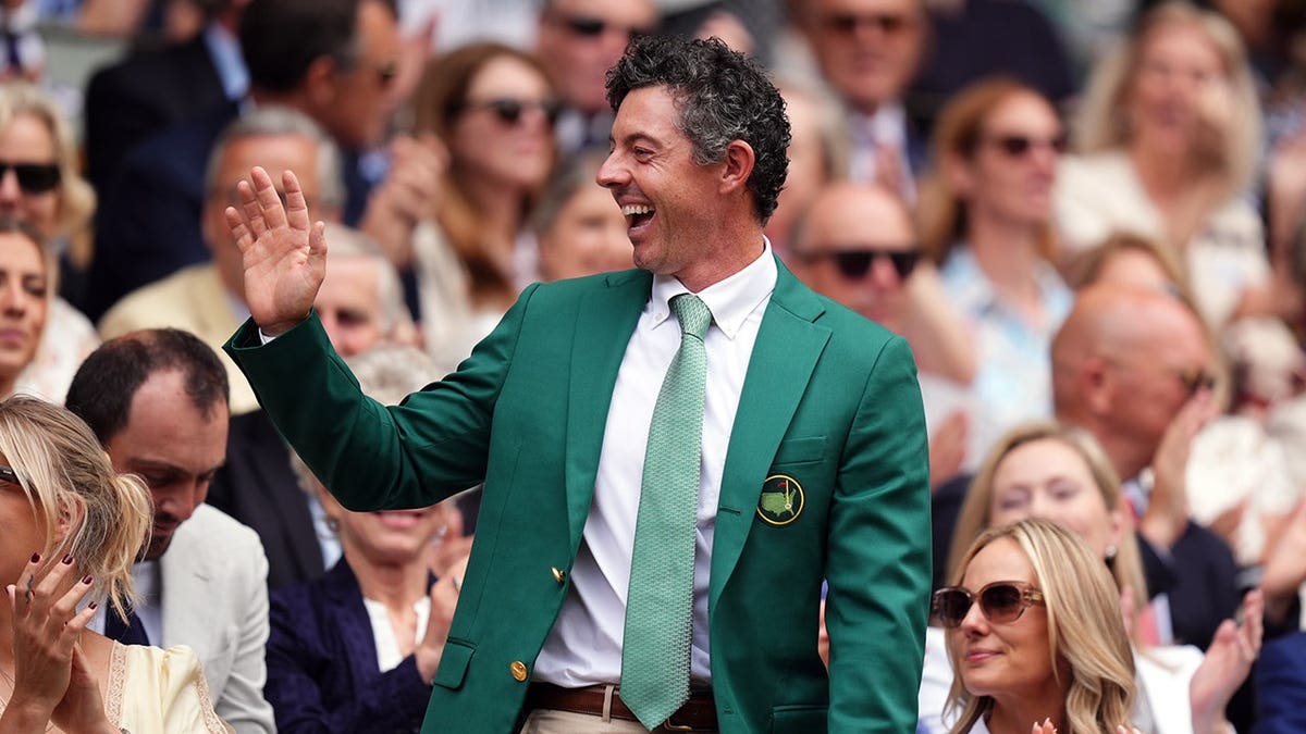 Rory McIlroy waves at Wimbledon