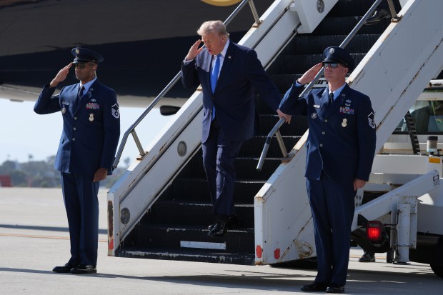 President Donald Trump arrives on Air Force One, Tuesday, Aug. 4, 2026, at Los Angeles International Airport in Los Angeles. (AP Photo/Mark Schiefelbein)