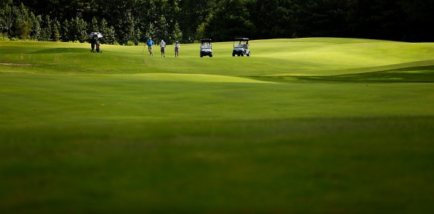 The greens at Virginia Beach National Golf Club look like the sand dunes of a dessert Thursday, August 6, 2026, morning. (Stephen M. Katz / The Virginian-Pilot)