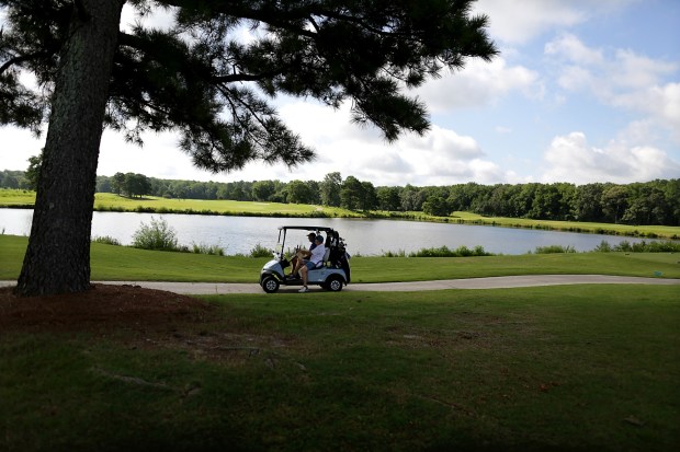 Golfers take advantage of Thursday, August 6, 2026, morning's mild weather to hit the links at the Virginia Beach National Golf Club. (Stephen M. Katz / The Virginian-Pilot)