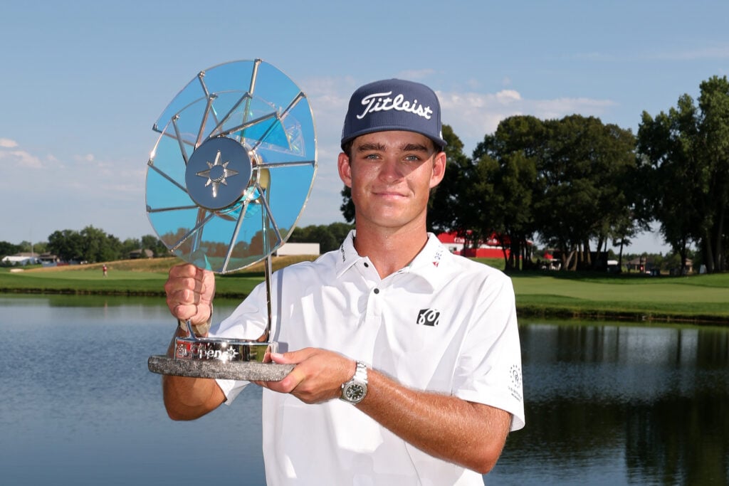 Jackson Koivun poses with the Elemental Swing trophy after winning the 3M Open 2026 at TPC Twin Cities